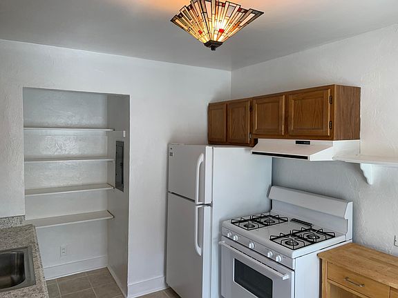 Gorgeous Kitchen with Ceramic Tile floor, New counter and garbage disposal, gas stove, fridge, and with a large pantry.