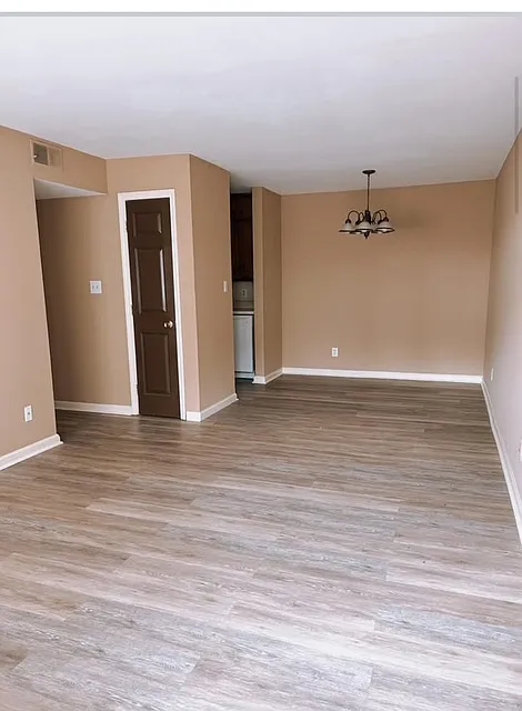 Open Living room/Dining room area - Oak Ridge Apartments