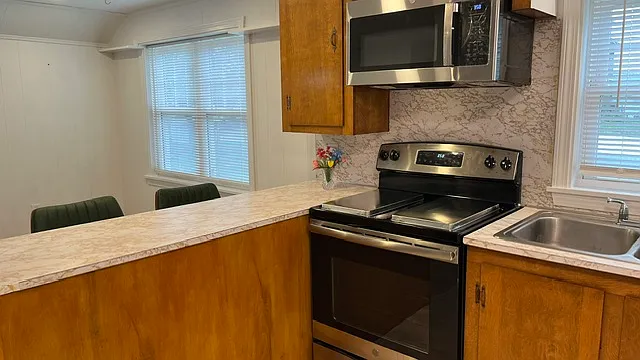Lovely kitchen island includes 2 new counter height bar stools