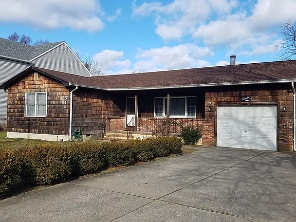 Front of House with Covered Porch and the garage