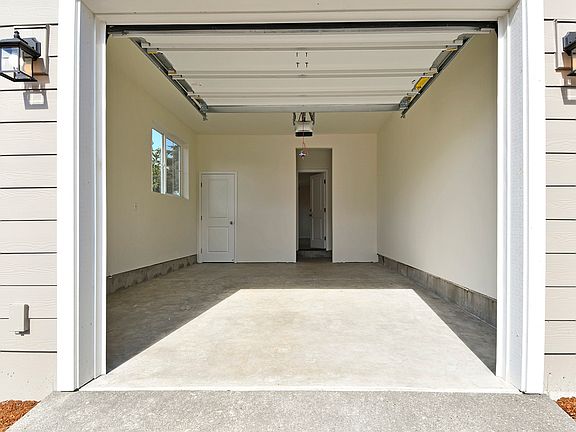 The Apple includes an attached garage with a Wi-Fi-enabled opener and private driveway.