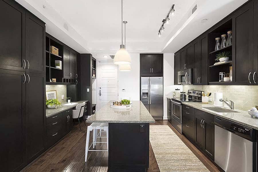 Beautiful open kitchen. Custom kitchen Cabinets, designer tile backsplash Stainless steel appliance package, Premium granite counter tops.