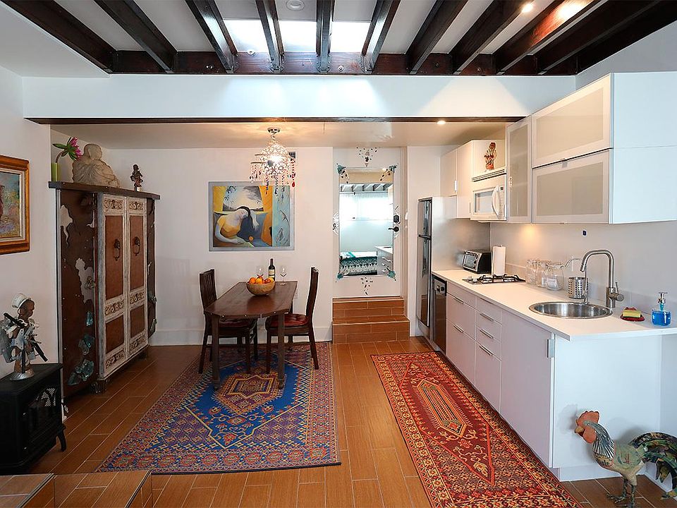 Studio overview of dining and kitchen area