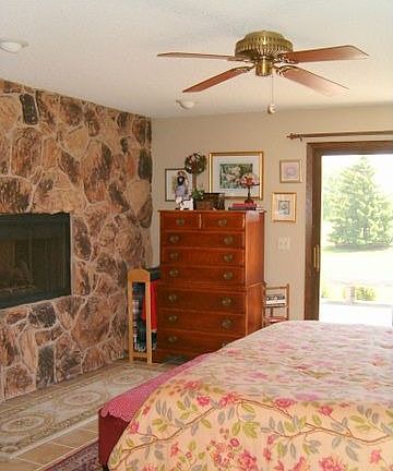 Two sided fireplace shared by master suite & bath.