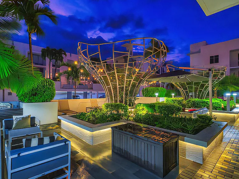 Evening Courtyard Lounge with Sculptural Lighting at South of Atlantic