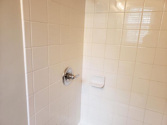 Bathroom with tub and shower