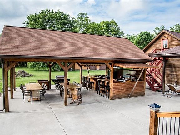 ~ Host anything you like in this inviting Covered Picnic Shelter!  The steps up to the area above the garage could be finished i