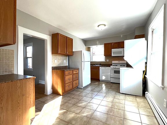Large kitchen with laundry in unit.
