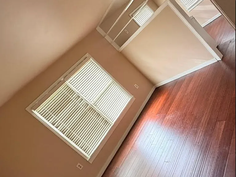 Refinished wood floors with an open bright floorplan.