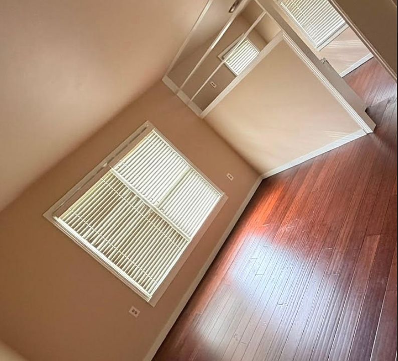 Refinished wood floors with an open bright floorplan.