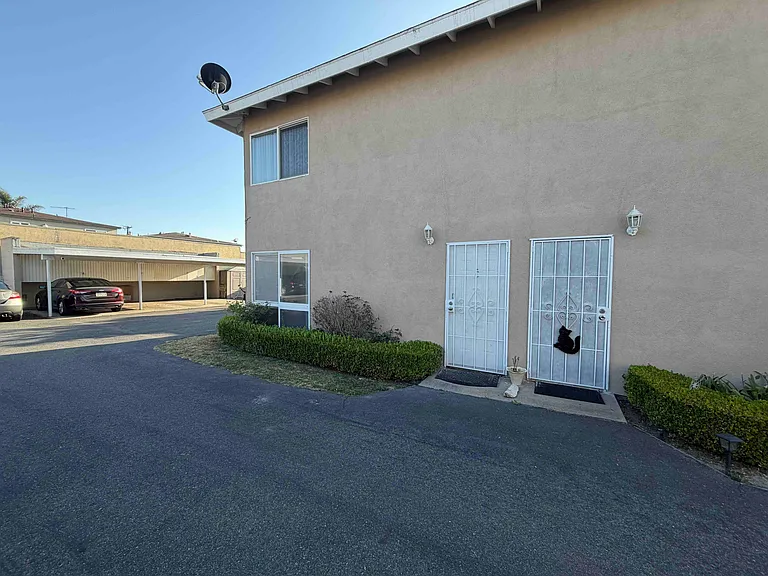 1. Entrance is door on left
2. Apartment windows on first and 2nd floor