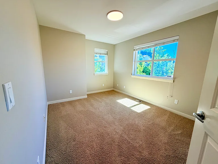 Upstairs bedroom with plenty of sunlight.