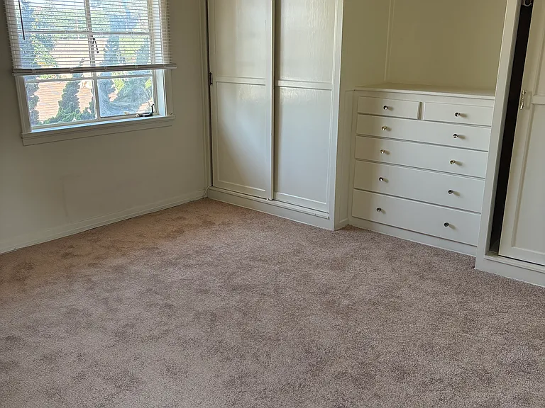 Bedroom with built in dresser
