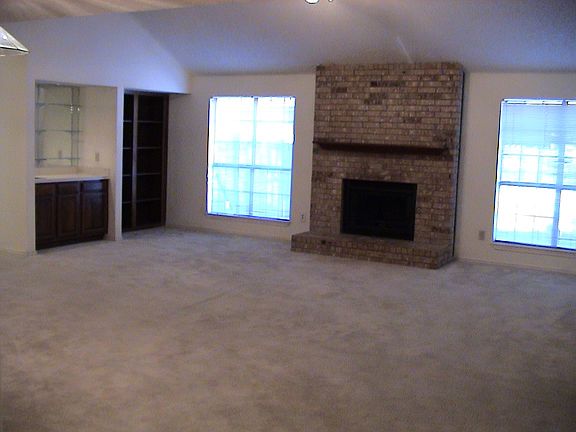 Large Living Room Has Vaulted Ceilings and Fireplace !