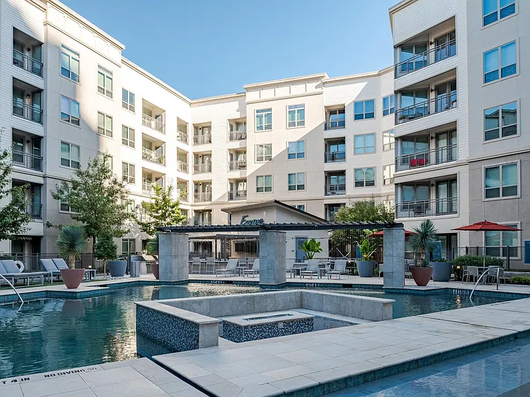 Resort-Style Pool with Water Features and Private Courtyard Seating