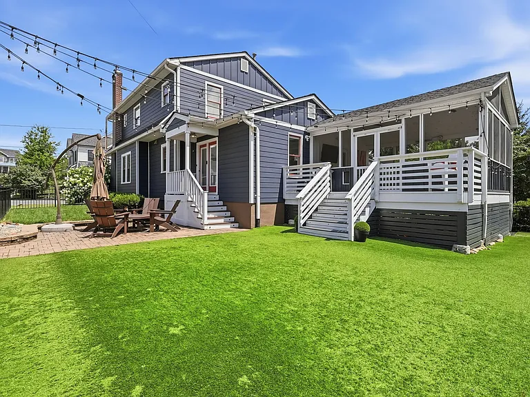 Private fenced backyard with patio and lawn