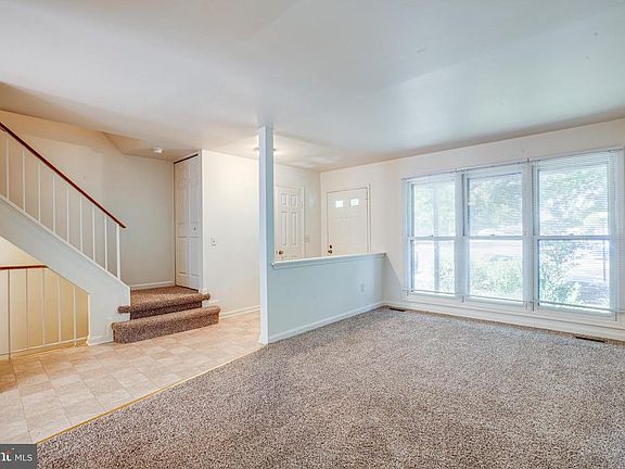 Enter the foyer to see brand new carpeting.