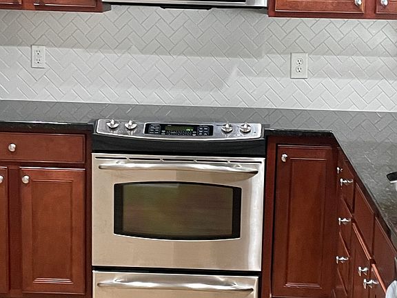 Kitchen with Stainless appliances, including a NEW LG dishwasher.