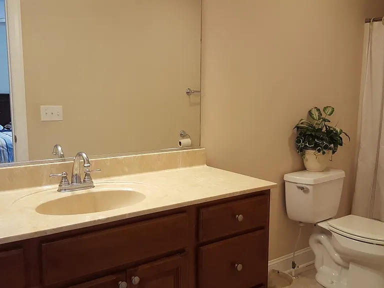 2nd Floor full master bathroom. Sink, toilet, and tub shower combo