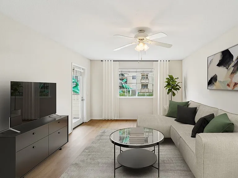 Renovated Package I living room with hard surface flooring