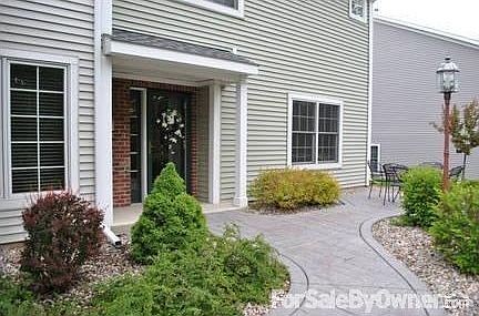 Entrance
						:
						A stamped concrete path, landscaped w/ lush greenery, leads you to the entrance.