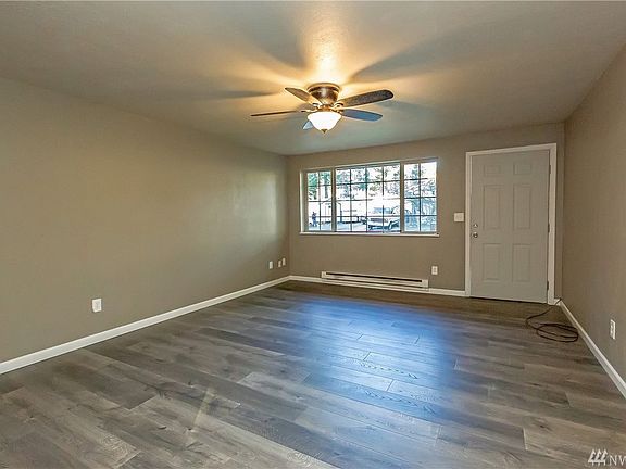 In addition to the new roof, the current owner recently installed these beautiful laminate floors throughout all the living areas, as well as the kitchen.