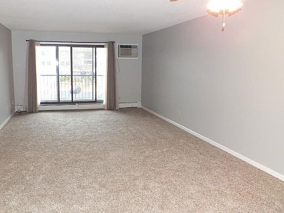 Looking into living room from the front door.  New carpet, installed last week.