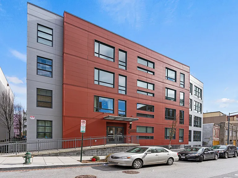 Champlain Street facade with ramp walkway to first floor, main entrance.