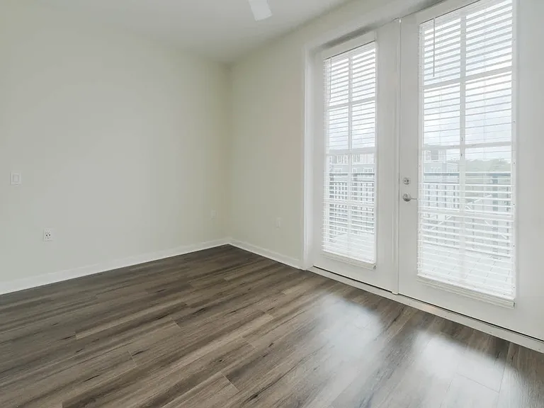 Bedroom with Balcony and Hard Surface Flooring