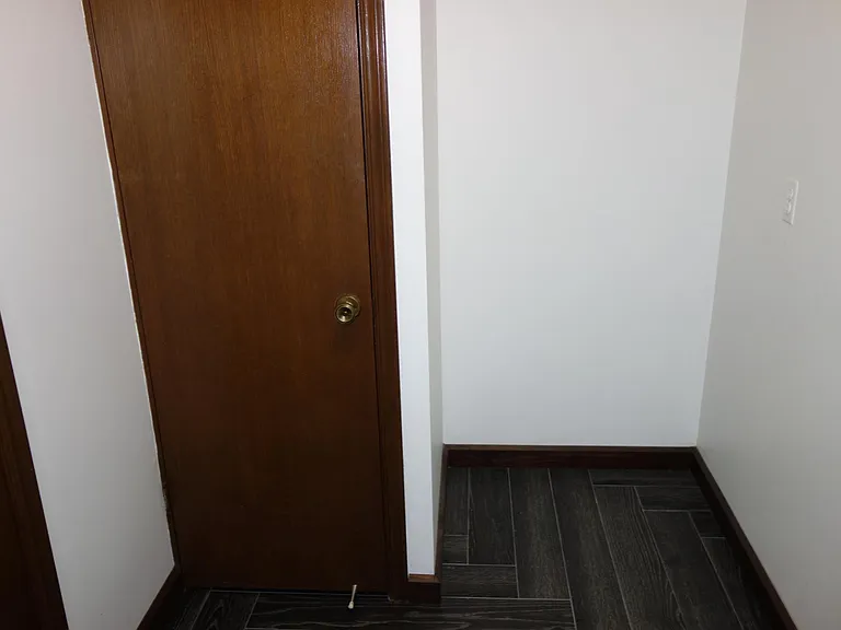 other side of laundry room with storage closet and nook!