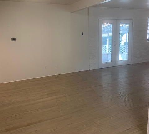 Eating Area off the kitchen is open to Family Room with Atrium Doors to Screened in Patio