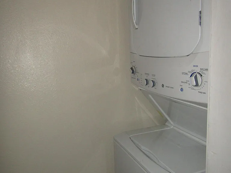 Stacked washer & dryer included