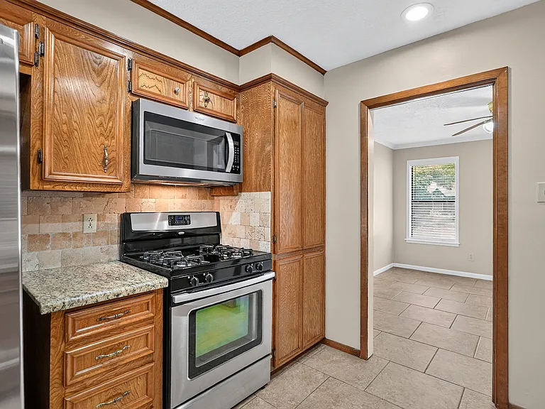To the right is the dining room or alternate office area