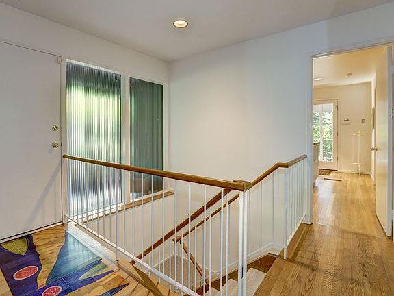 Foyer with Frosted Glass and Floating Stairs
