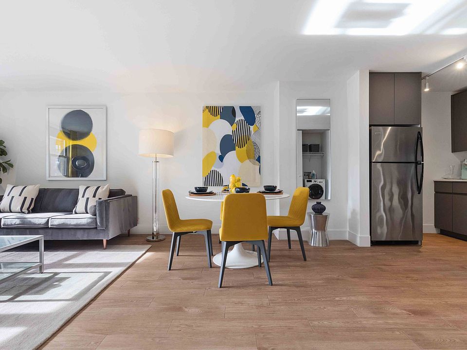 Open concept living area with wood-look plank flooring