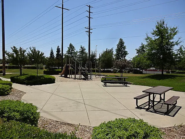 Full Playground (very safe) with additional parking and room for picnicking, benches/tables.