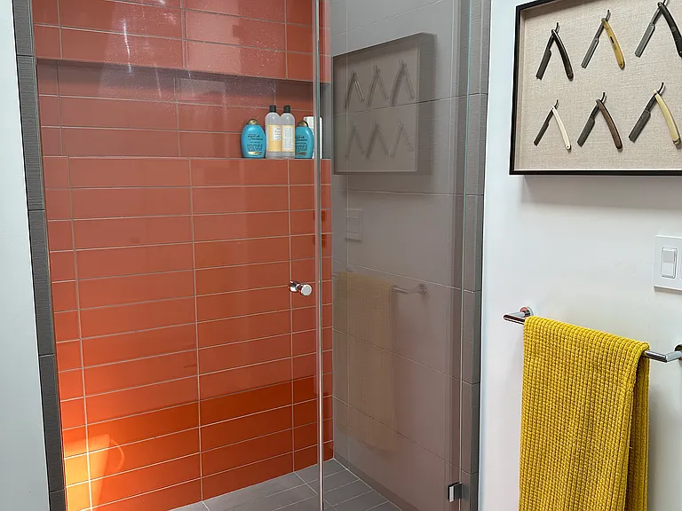 Modern guest bedroom with shower across from the guest bedroom