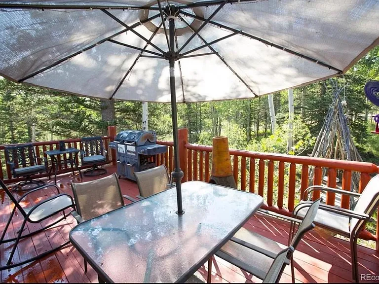 Wood porch with tepee in the back