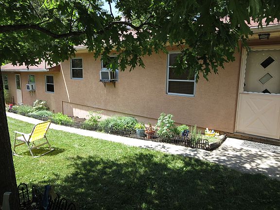 Fenced yard w/ front doors