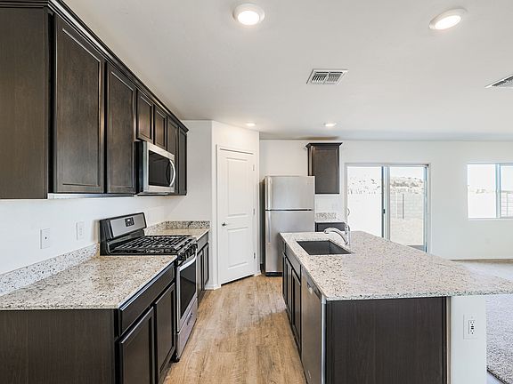 You ll love cooking in this upgraded kitchen with a gas range stove and kitchen island.