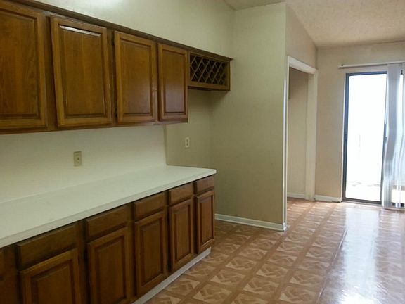 Large Kitchen with Plenty of Cabinet Space, Breakfast Area and Utility Closet