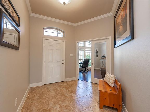Off-set tile flooring welcomes you into this pristine home.