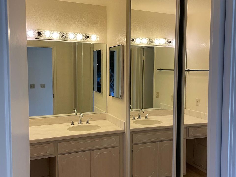 dressing room with large mirrored closet doors