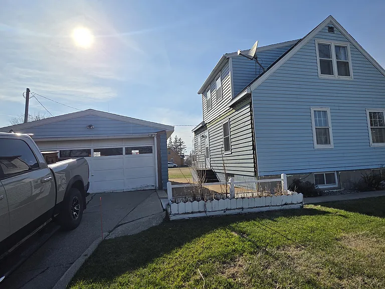 Detached two-stall garage and back of home