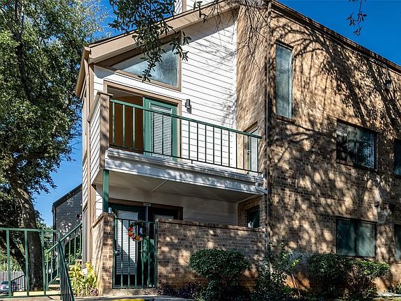 This 2-story unit is located on the second floor. Here is view of the living room balcony on 2nd floor