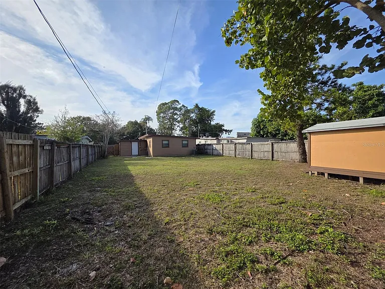 View of Backyard (looking from fence to backdoor)