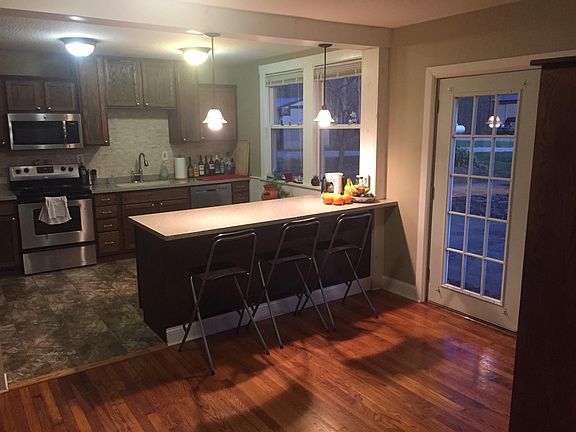 Kitchen from foyer. Lots of sun through south-facing glass doors and windows.