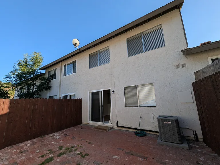 Private Patio between Condo & Garage
