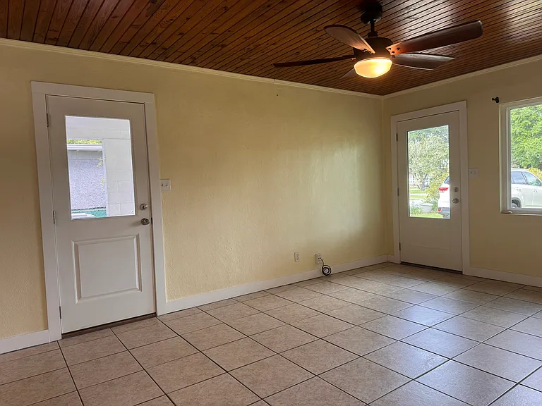 living room, doors to carport and front yard