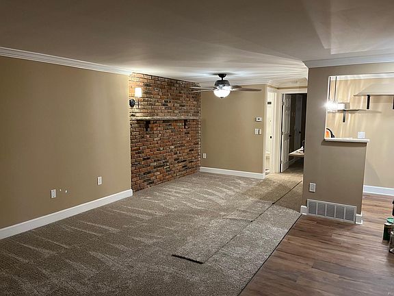 Real brick accent wall. New ceiling fan.